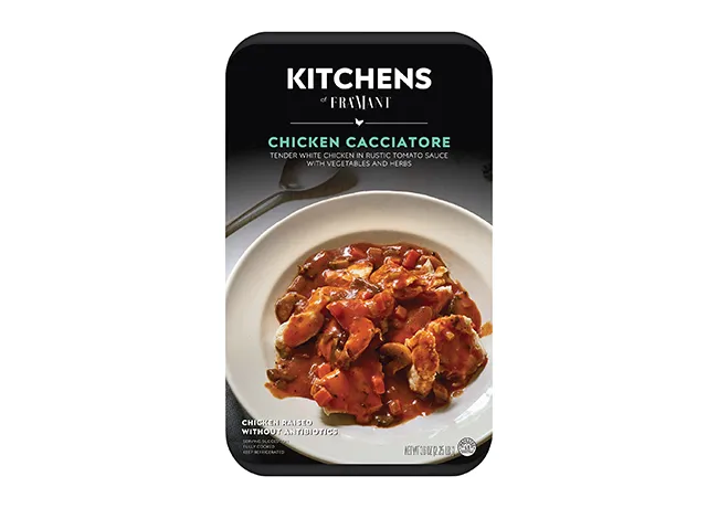 Hearty chicken cacciatore served in a rustic kitchen setting.