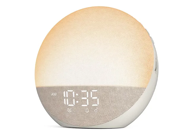 "Sunrise alarm clock on a bedside table"