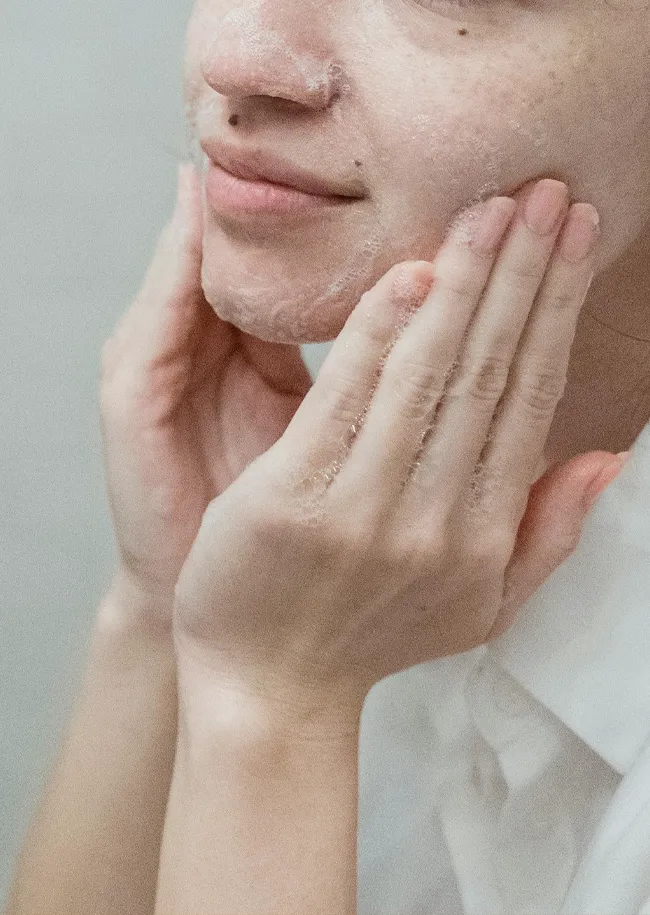 woman-exfoliating-skin
