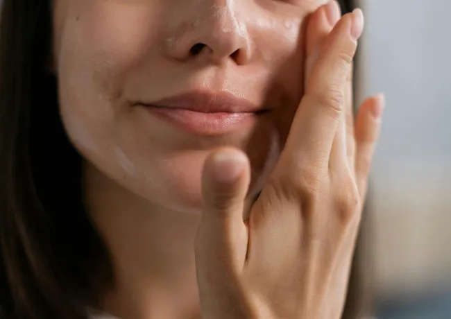 woman-moisturizing-skin