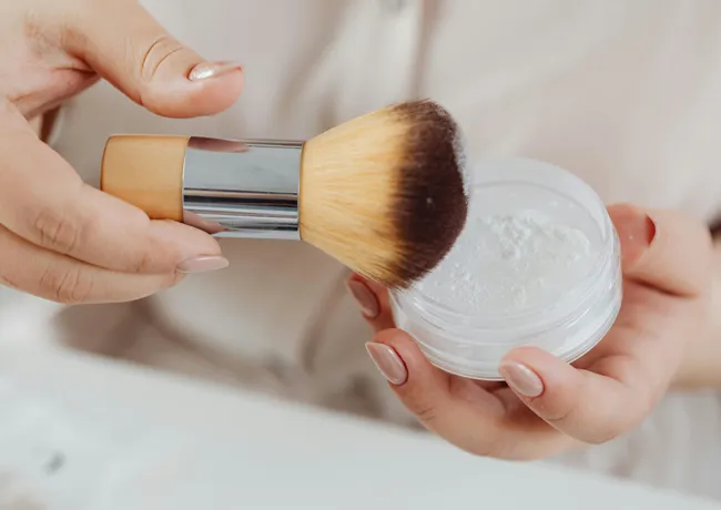 woman-using-brush-powder