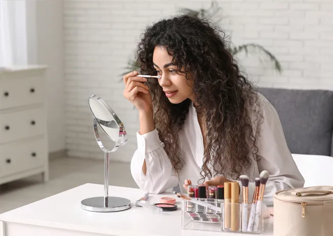 young-woman-applying-makeup
