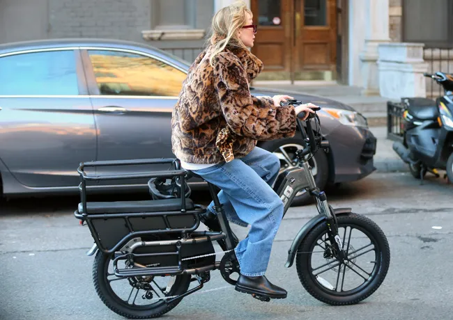Jennifer Lawrence riding bike without helmet New York leopard jacket
