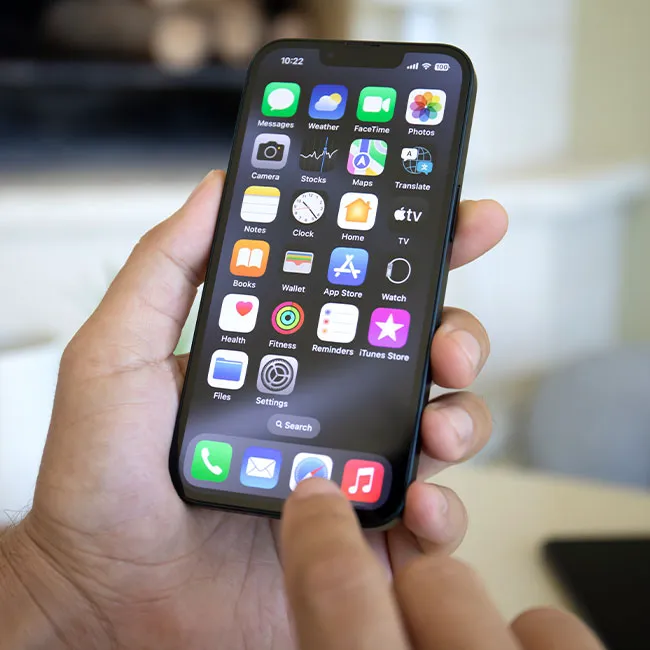 Man holding iPhone 17, showcasing modern smartphone features.
