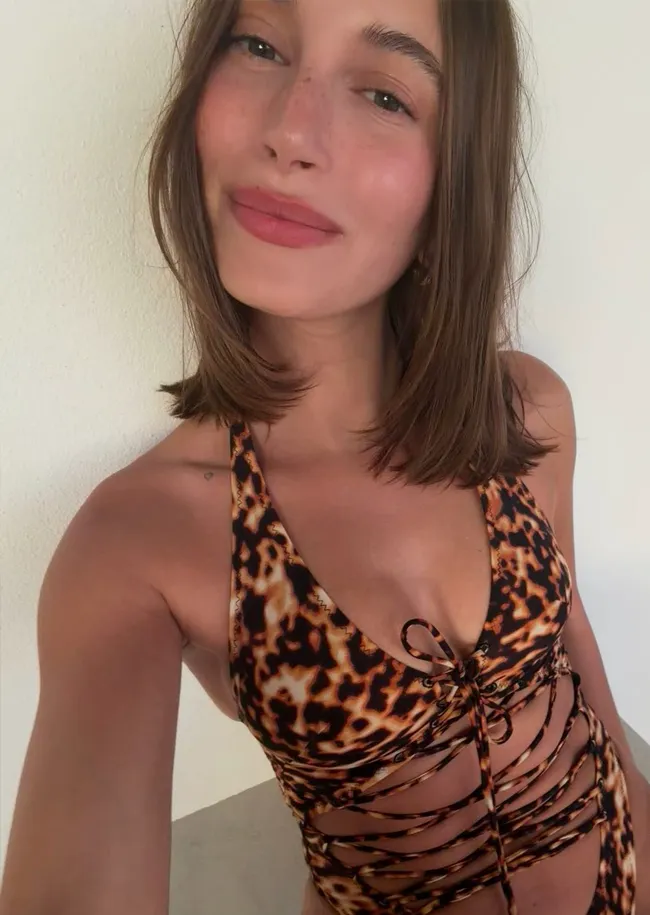 Hailey Bieber posing in colorful bikini on Instagram