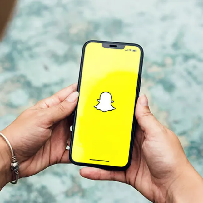 Multiple Snapchat app screens displayed on a smartphone.