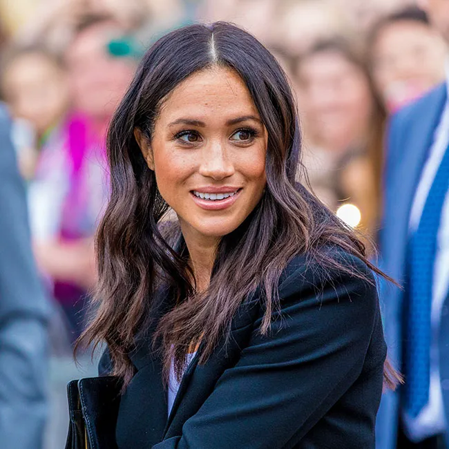 Meghan Markle wearing a stylish black blazer.