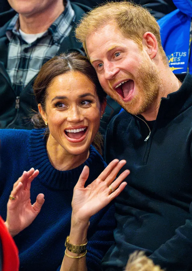 Prince Harry and Meghan Markle waving