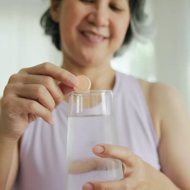 "Vitamin C serum bottle on a flat surface"