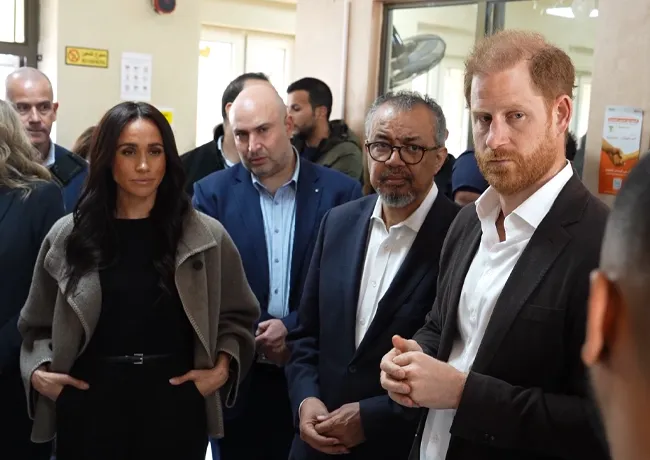 Harry and Meghan visiting a refugee camp in Jordan.