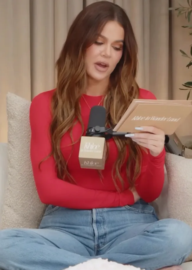 Khloe Kardashian in red crop top and jeans at Wonderland event.
