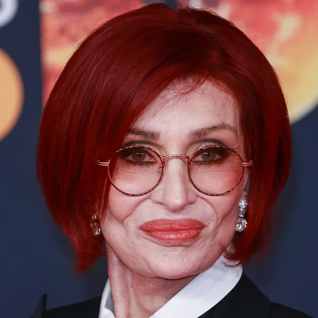 Sharon Osbourne attending The Brit Awards, wearing a stunning outfit.