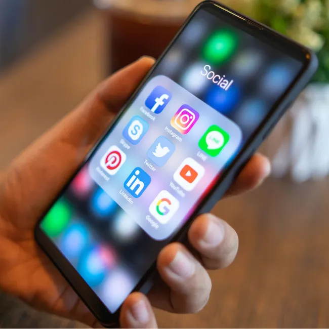 Social media apps displayed on a smartphone screen.