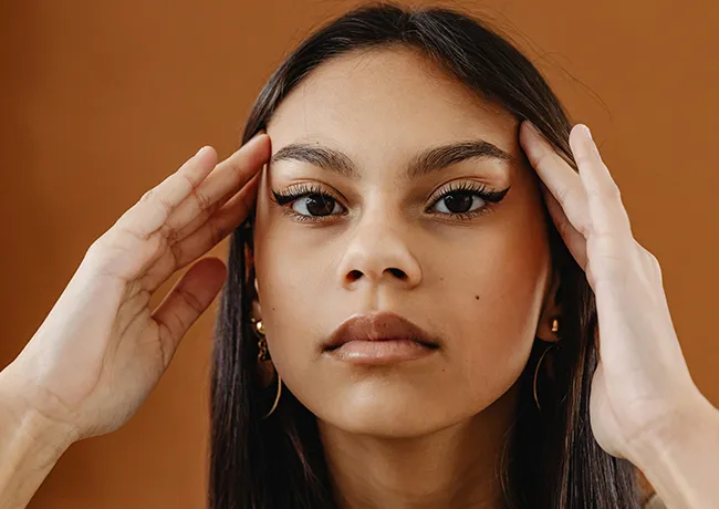 woman-touching-eyebrows