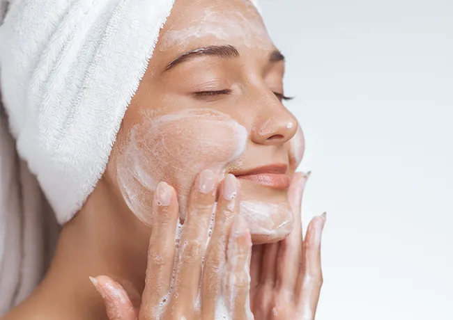 "Woman washing her face"