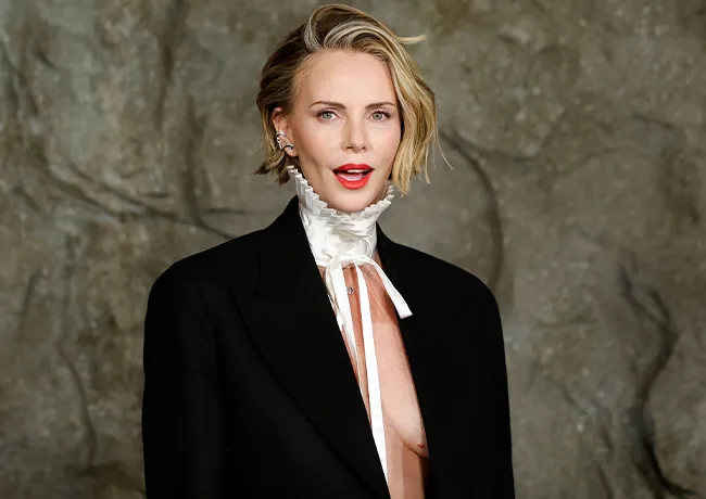 Charlize Theron Apex premiere Dior suit and collar