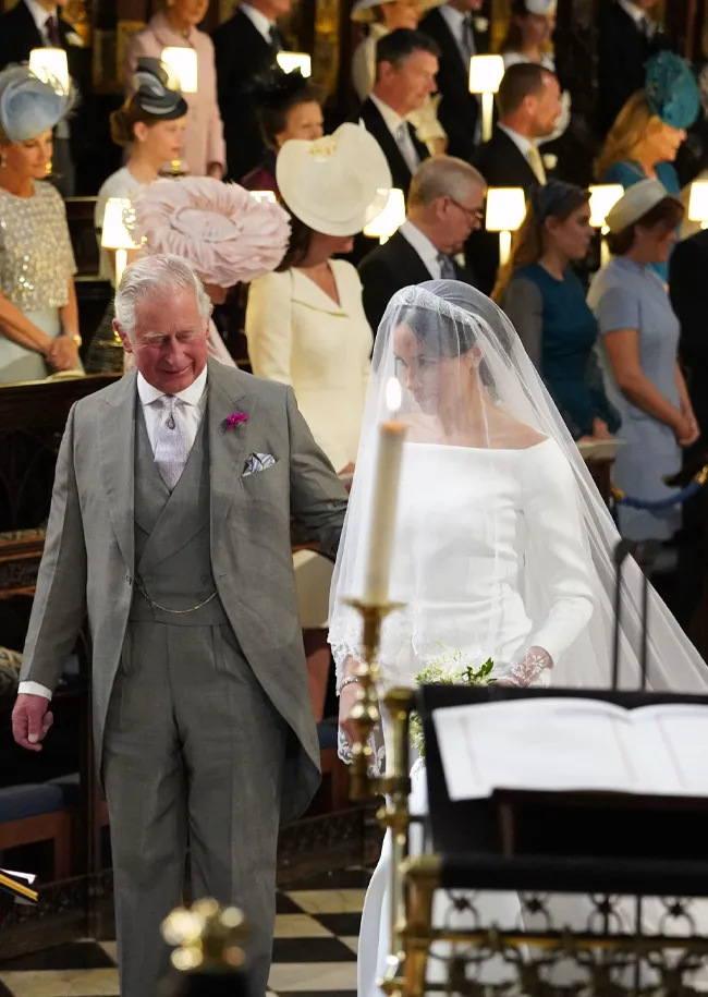 Meghan Markle and King Charles walking down the aisle royal wedding