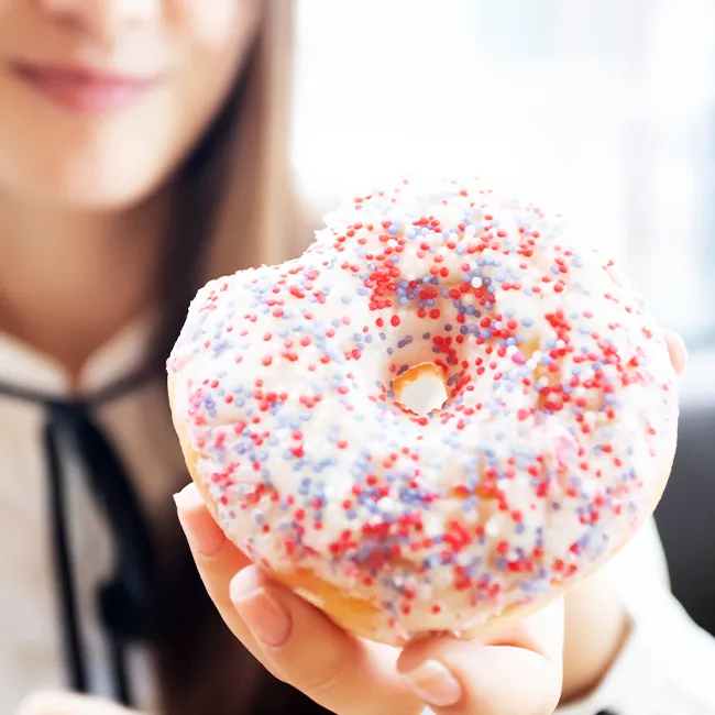 Woman holding a donut
