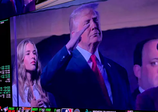 Kai Trump and Donald Trump at a Nick's game event.