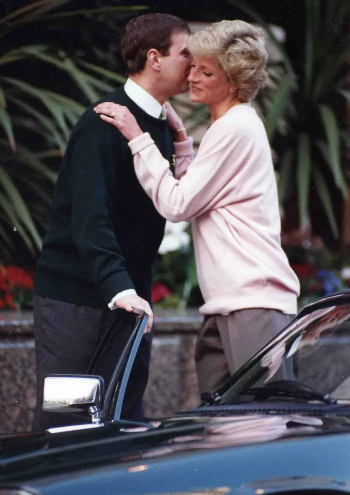 Princess Diana and Andrew hugging