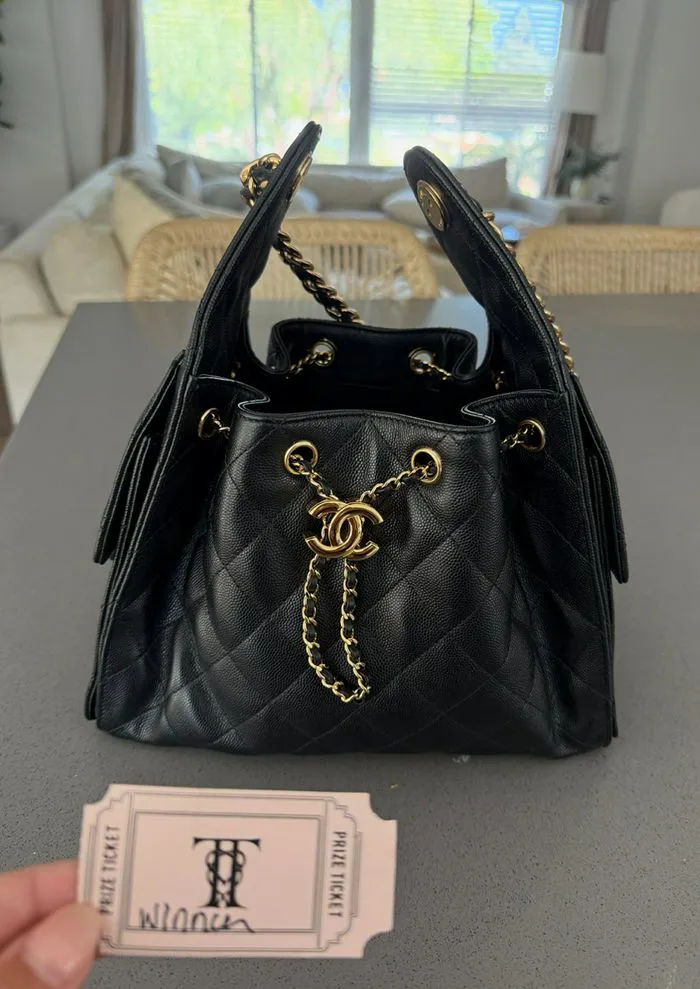 Jackie Tranquill with her Chanel purse won at Taylor Swift's wedding