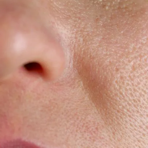 "A close-up of skincare products on a marble counter"
