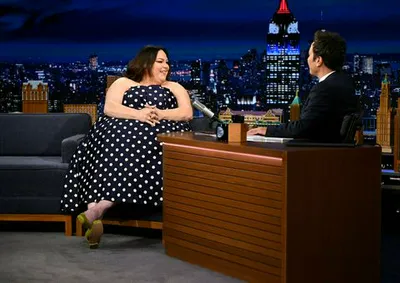 Chrissy Metz and Jimmy Fallon on The Tonight Show stage.