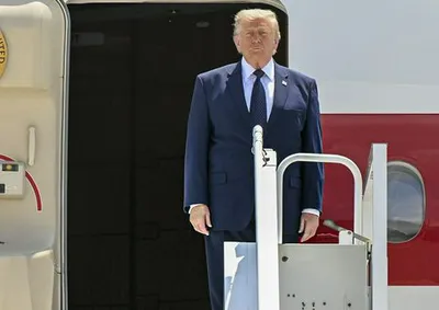 Donald Trump arrives at NATO summit for diplomatic discussions.
