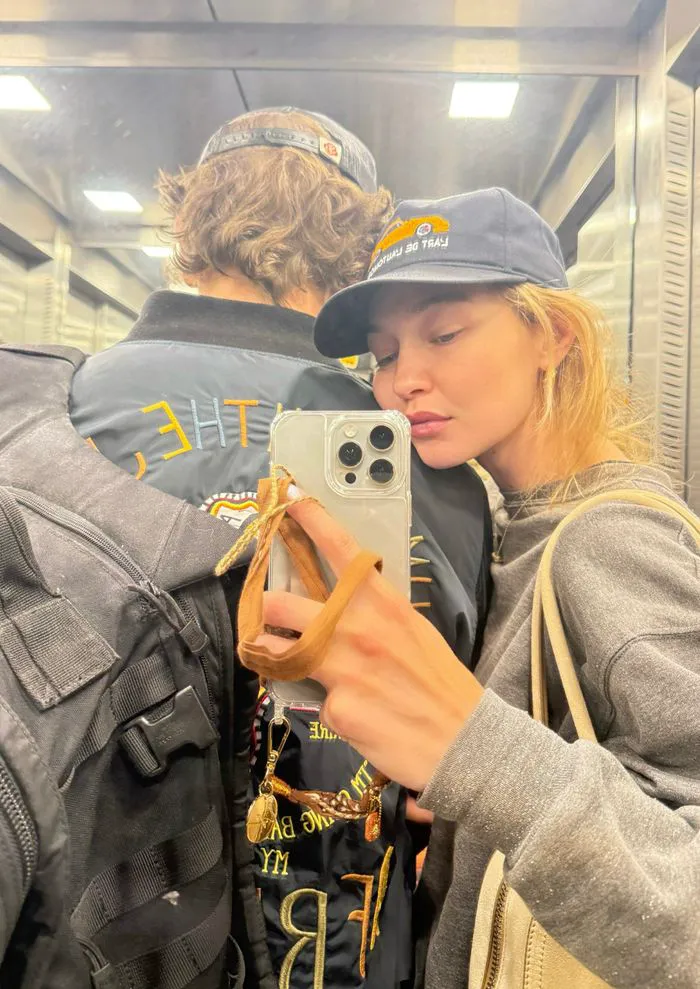Gigi Hadid and Bradley Cooper smiling in a selfie