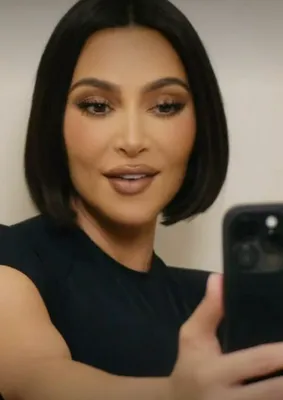 "Screenshot of Kim Kardashian in SKIMS ad with bob haircut"