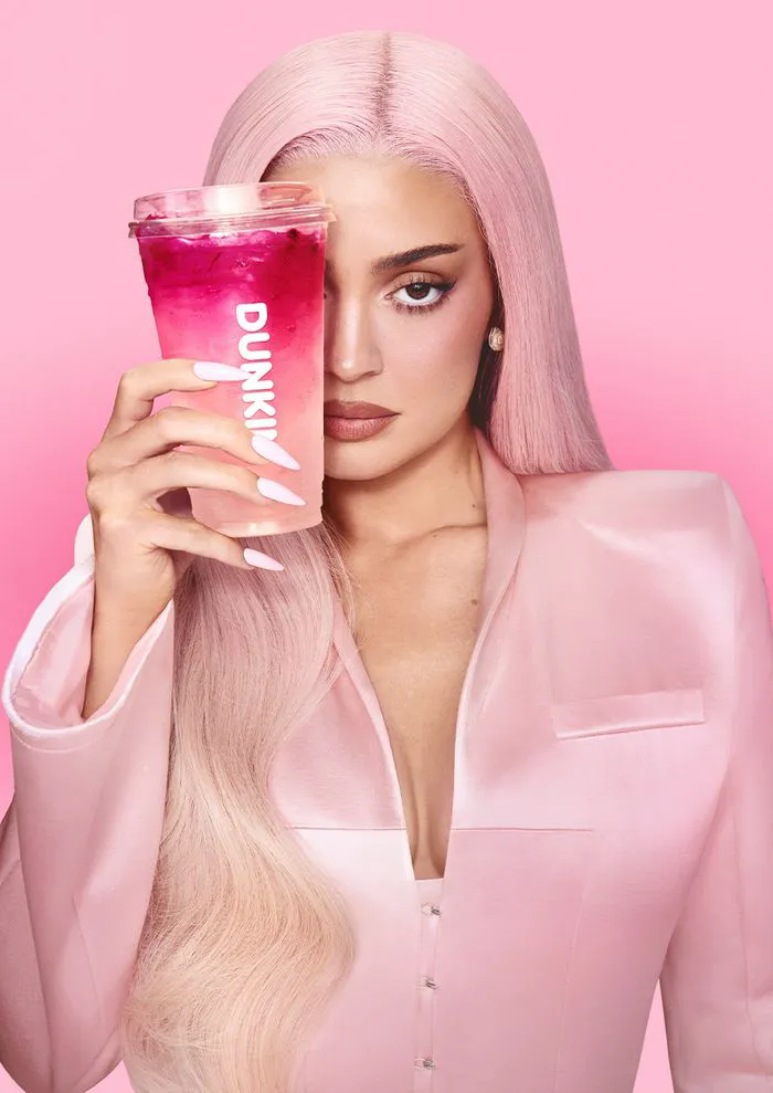"Kylie Jenner in pink outfit for Dunkin' Donuts commercial"