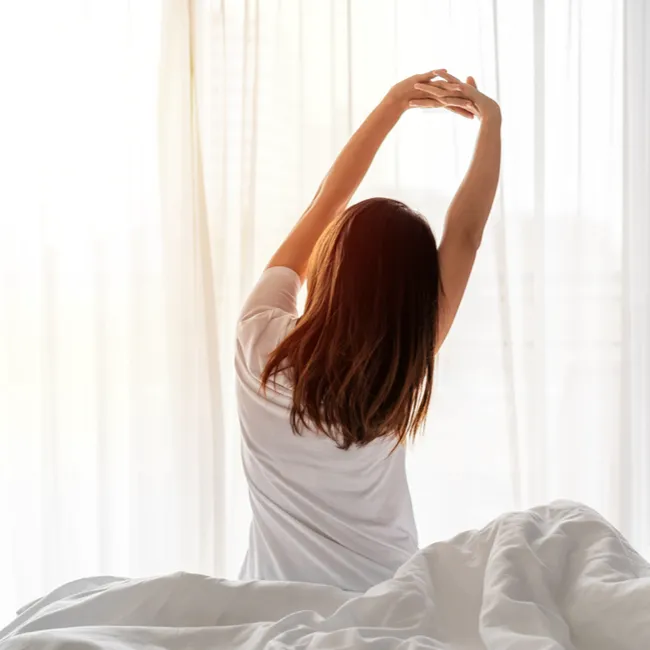 "Woman stretching in the morning"