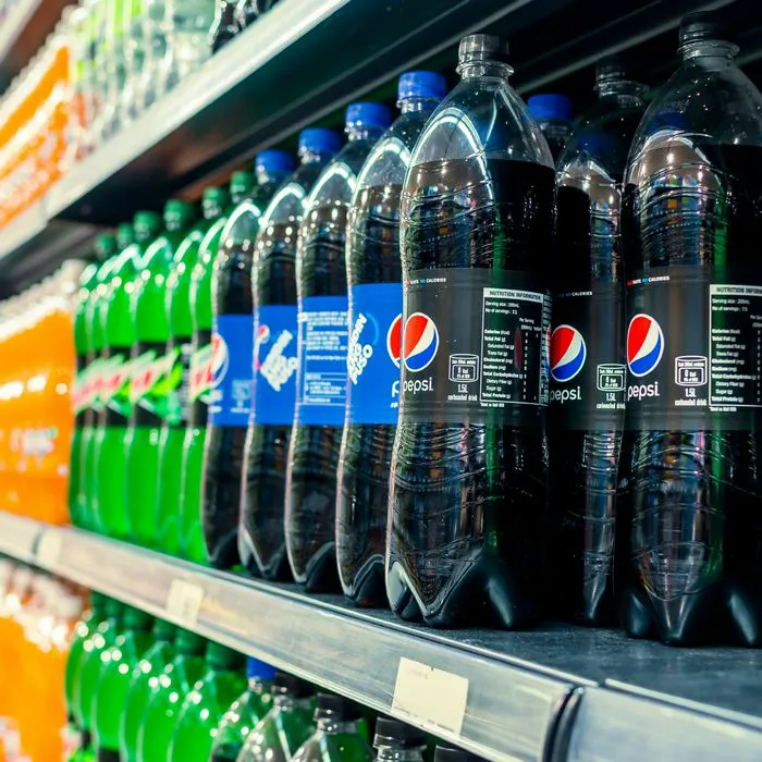 "Soda aisle in a grocery store"