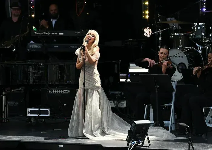 "Christina Aguilera in a semi-sheer light-gray gown at the Obama Presidential Center"