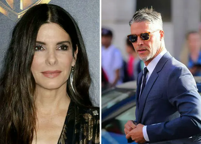 Sandra Bullock and Bryan Randall at a red carpet event.