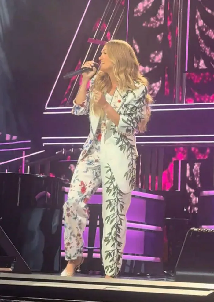 "Carrie Underwood in floral-print pantsuit at Grand Ole Opry"