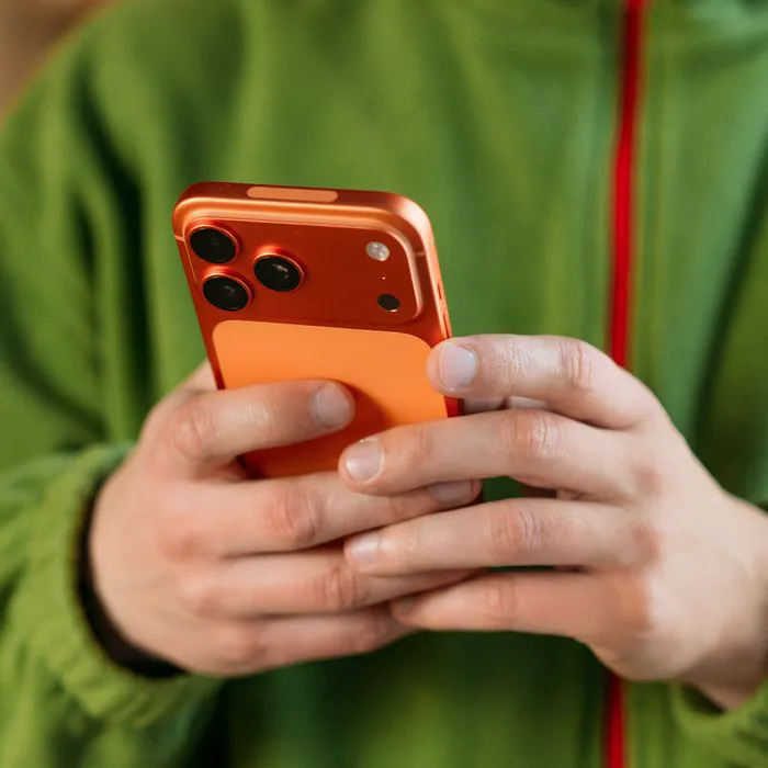 "Person holding an iPhone"
