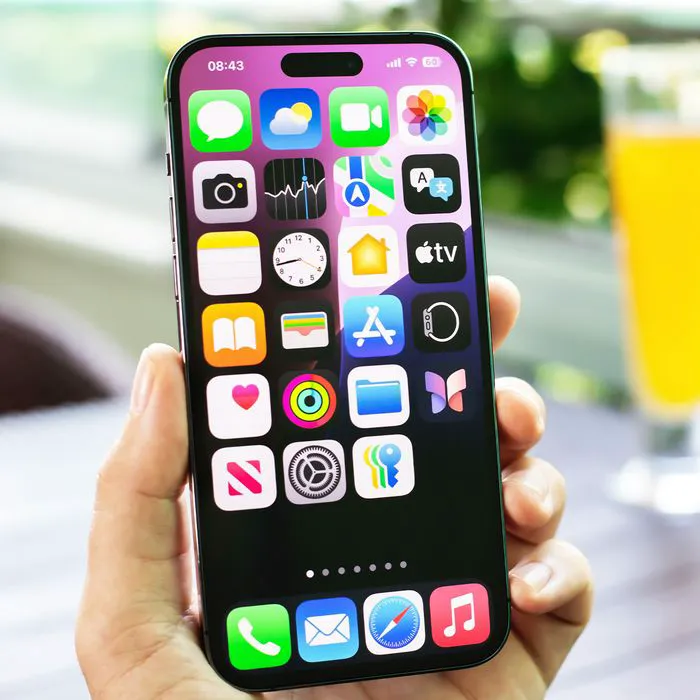 "Man holding an iPhone"