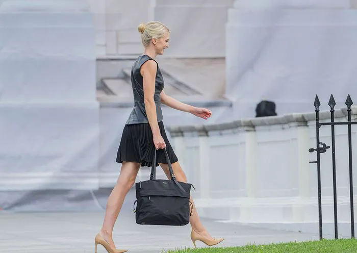 Natalie Harp in a stylish black dress for fall fashion.