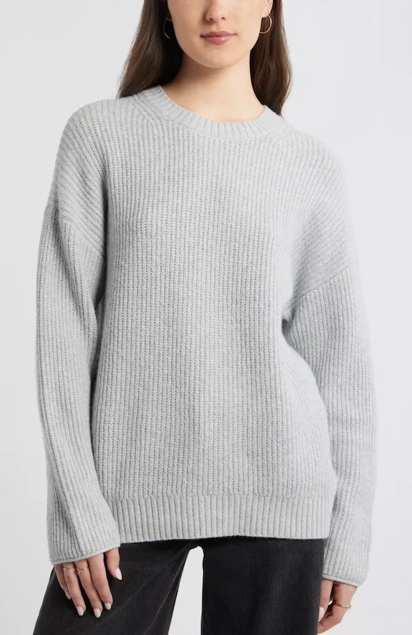 Cozy crewneck sweater perfect for chic pixie styling.