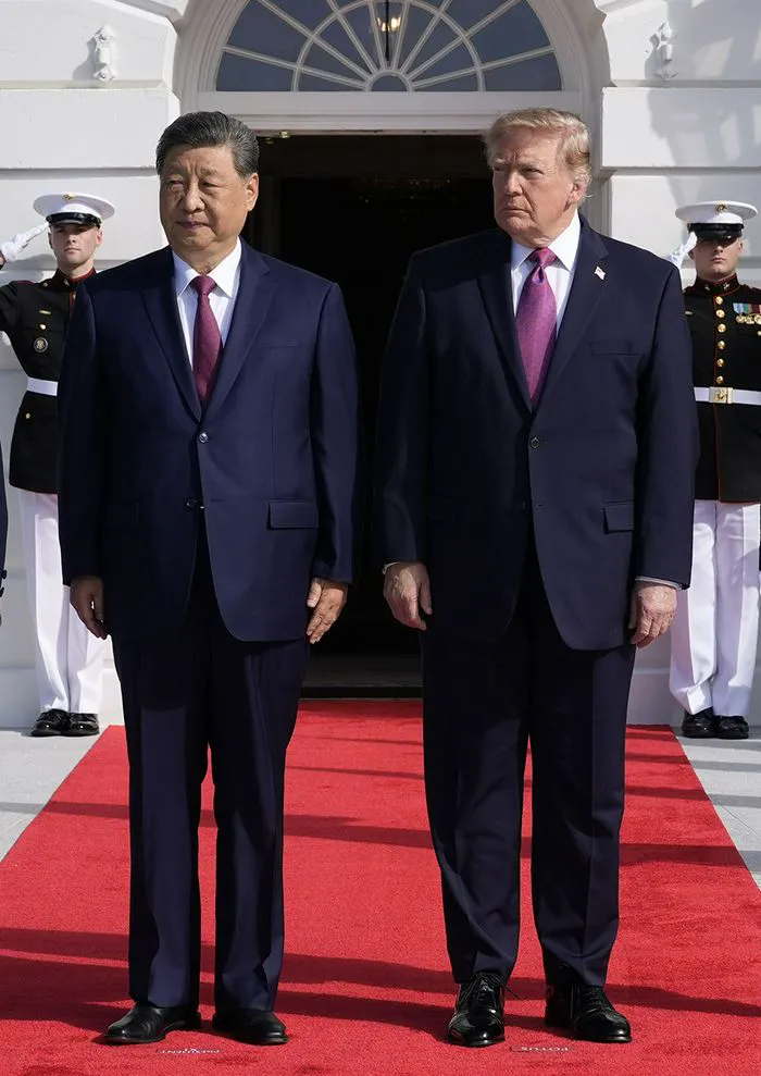 "Donald Trump standing next to Xi Jinping during state visit"