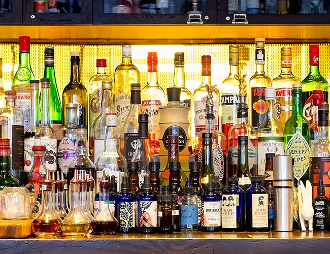 "Alcohol behind a bar"