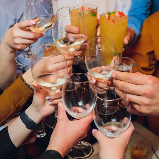 "People toasting with drinks"