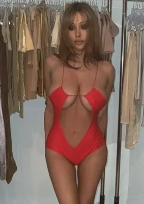Bianca Censori wearing a bright red cutout swimsuit