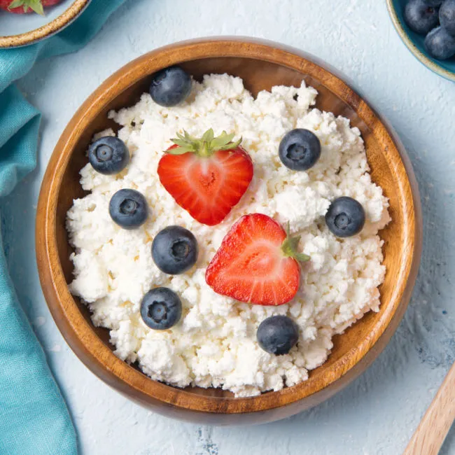 "Cottage cheese with mixed fruits in a bowl"