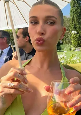 "Hailey Bieber in green halter dress at Finneas O'Connell's wedding"