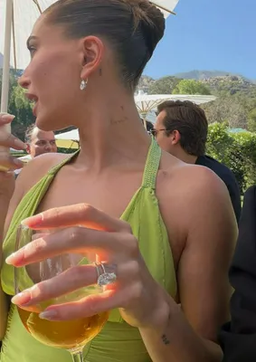 "Hailey Bieber in black dress at wedding"
