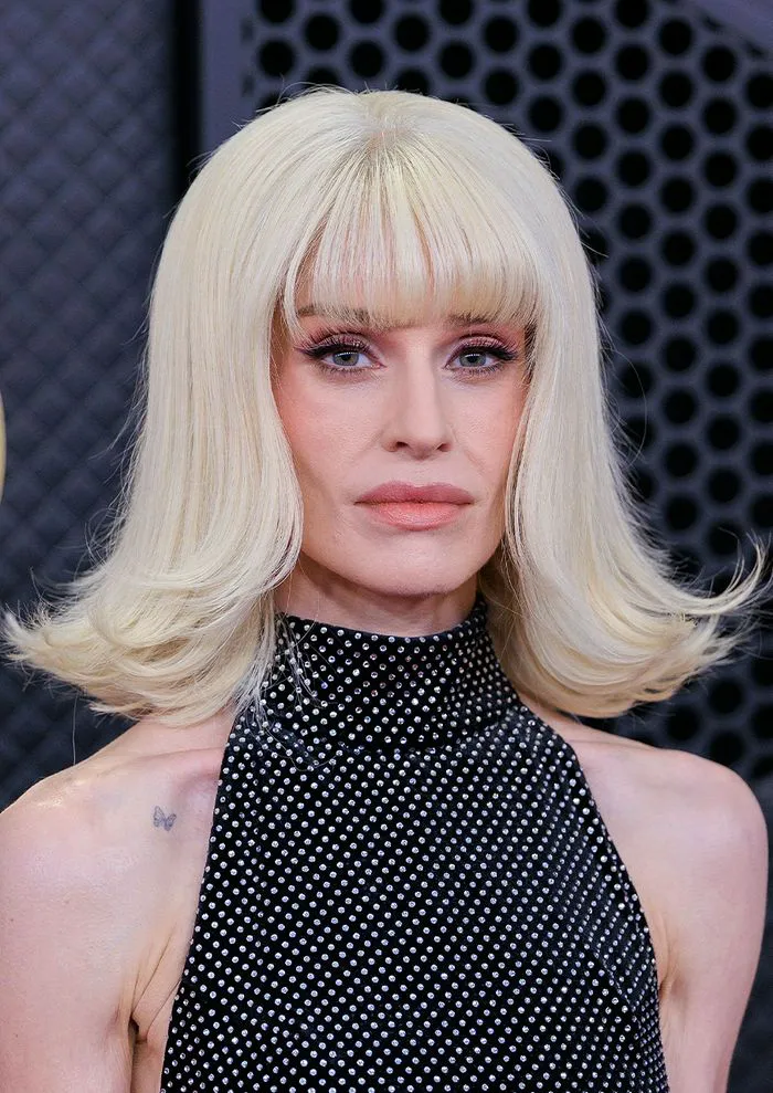 "Kelly Osbourne wearing a blonde wig"