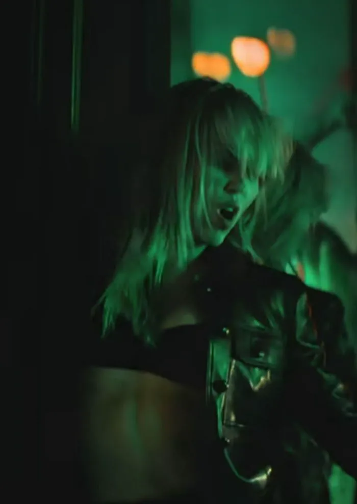 "Miley Cyrus in Leather Jacket and Micro Mini Shorts"