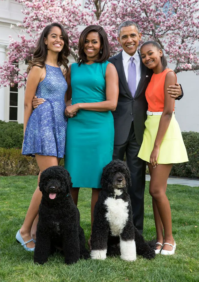 "Obama family with their dogs"